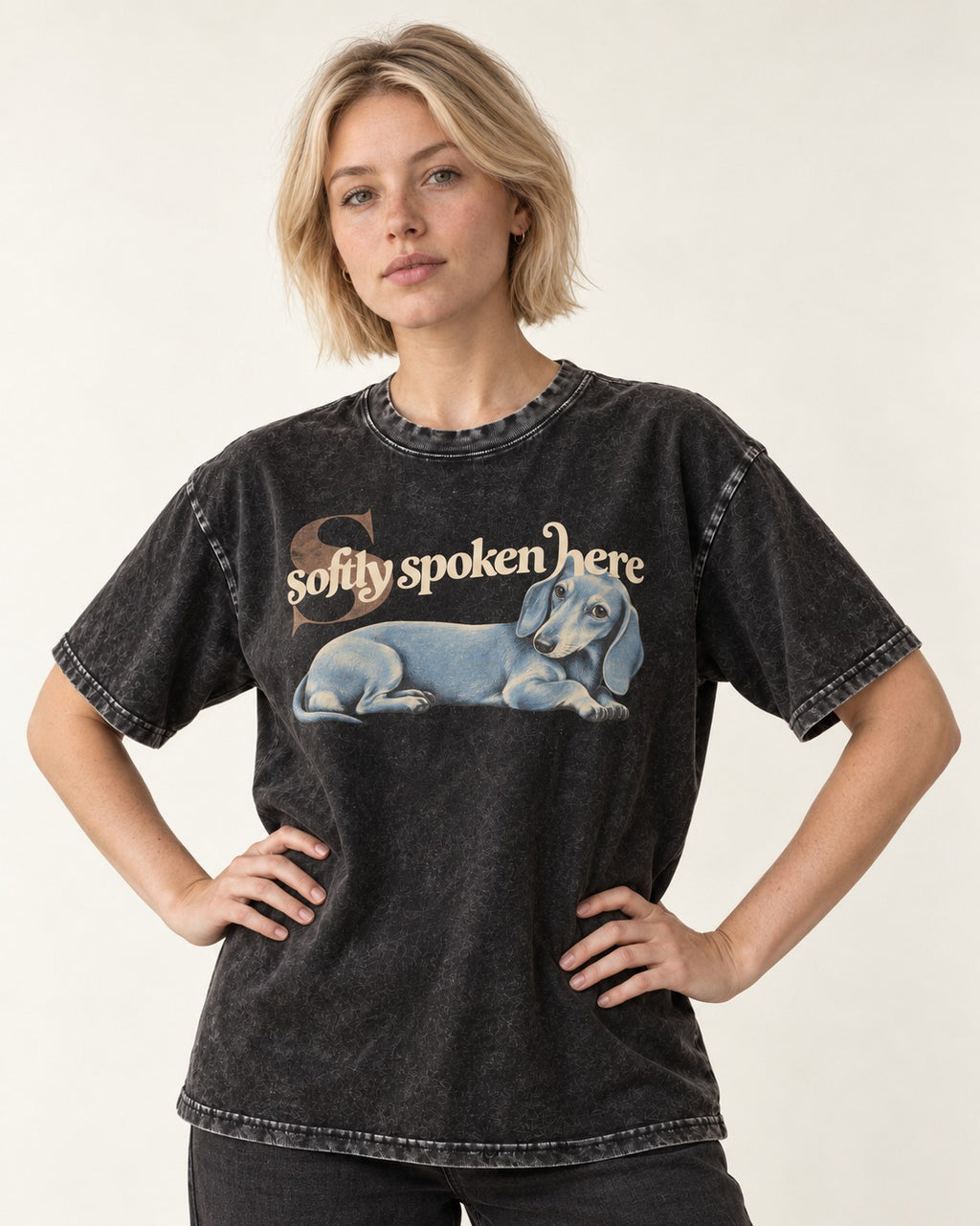 Dachshund Softly Spoken Here Reclining Portrait Graphic Washed Tee in Black, worn by a model