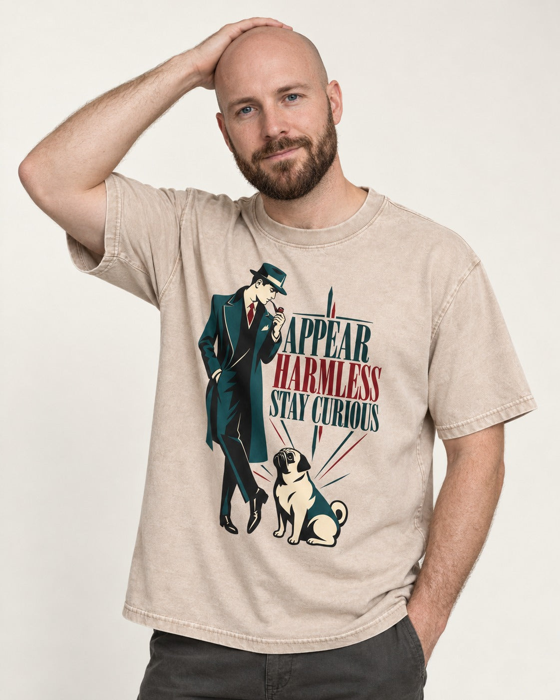 Pug Appear Harmless Stay Curious Washed Tee in Apricot, worn by a model