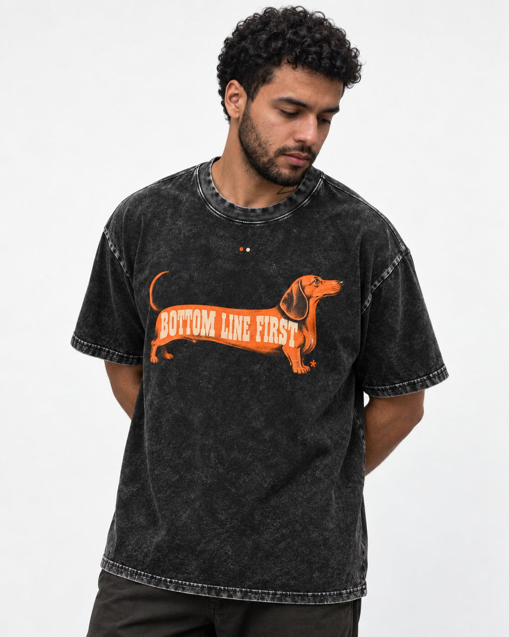 Dachshund Bottom Line First Body Lettering Graphic Washed Tee in Black, worn by a model
