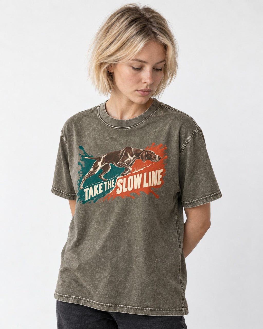 German Shorthaired Pointer Take The Slow Line Paint Splash Graphic Washed Tee in Army Green, worn by a model