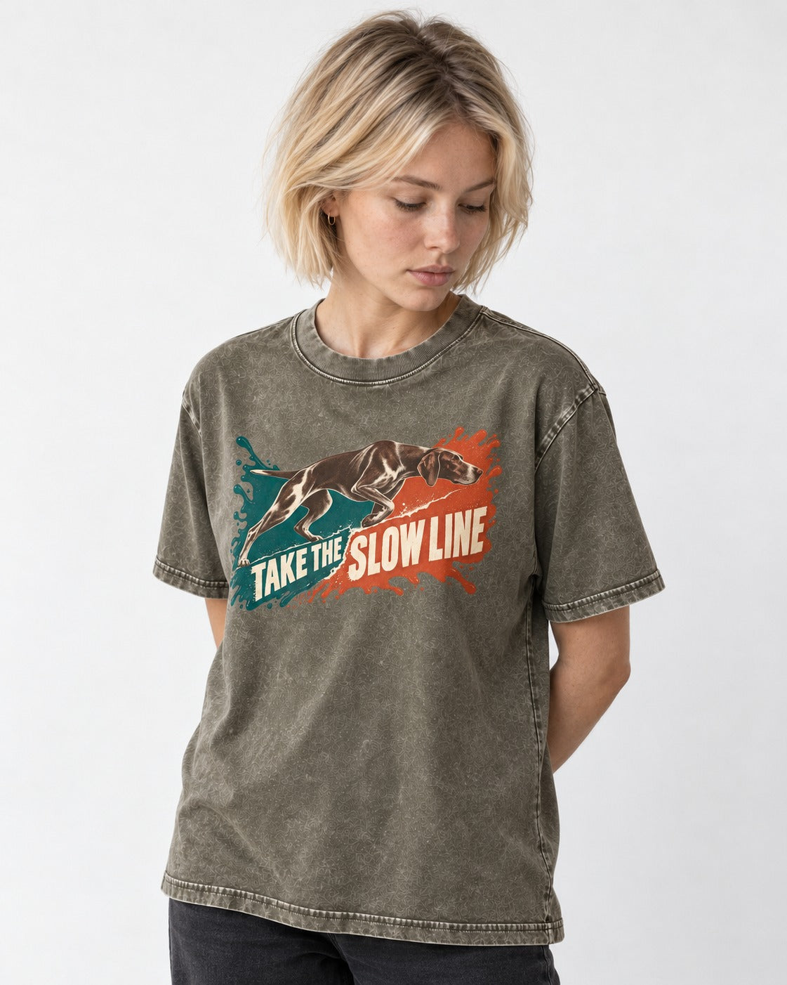 German Shorthaired Pointer Take The Slow Line Paint Splash Graphic Washed Tee in Army Green, worn by a model