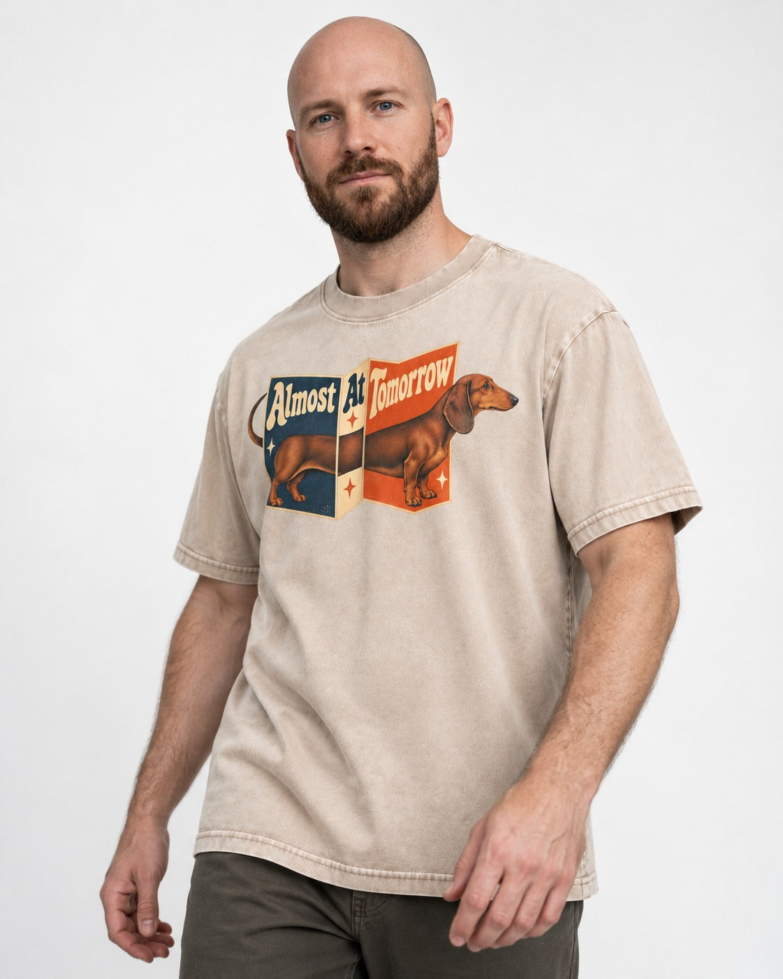 Dachshund Almost At Tomorrow Folding Screen Graphic Washed Tee in Apricot, worn by a model