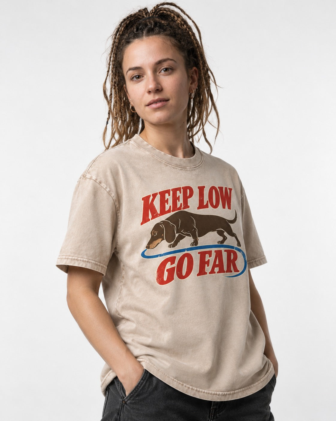 Dachshund Keep Low Go Far Washed Tee in Apricot, worn by a model