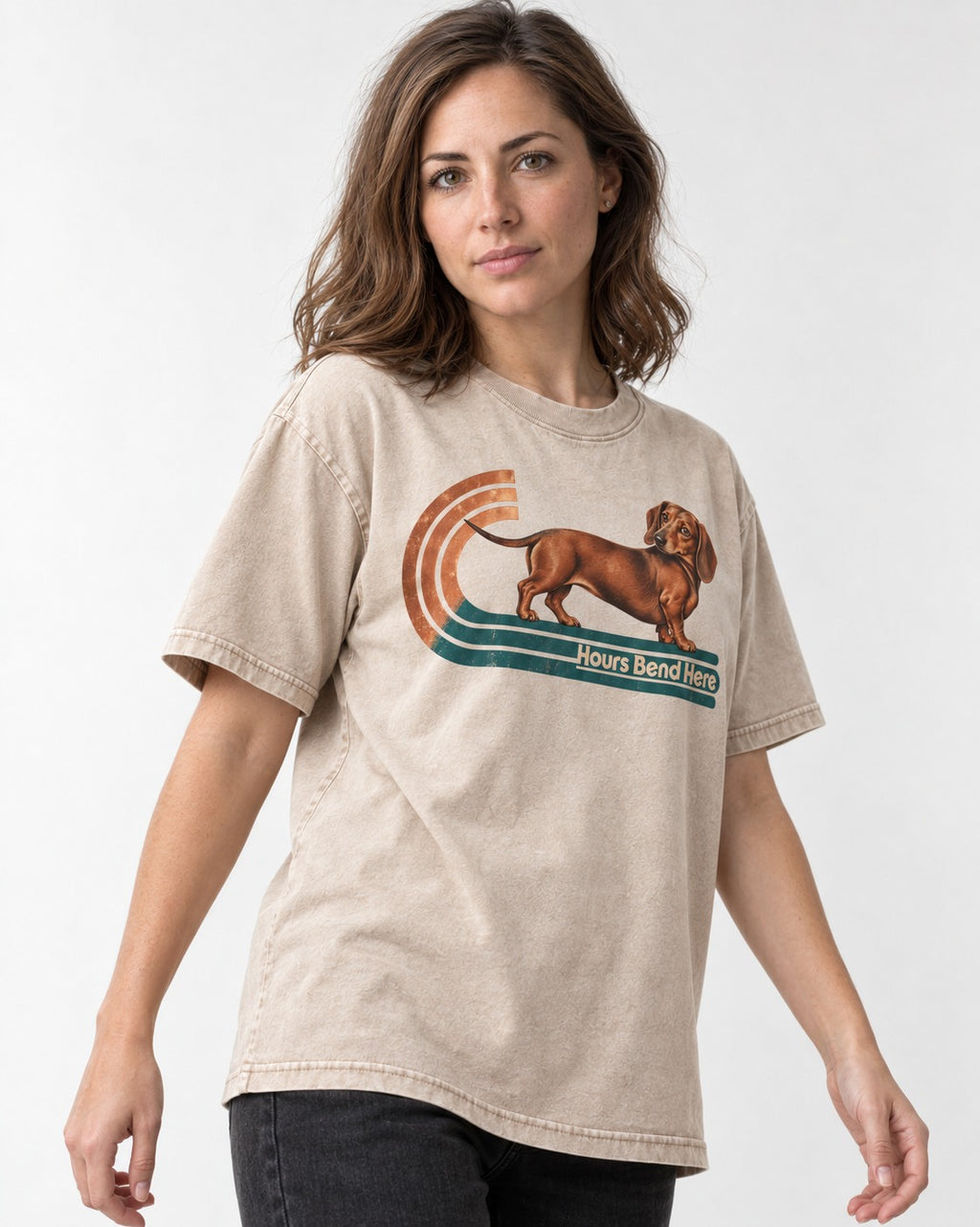Dachshund Hours Bend Here Retro Track Graphic Washed Tee in Apricot, worn by a model