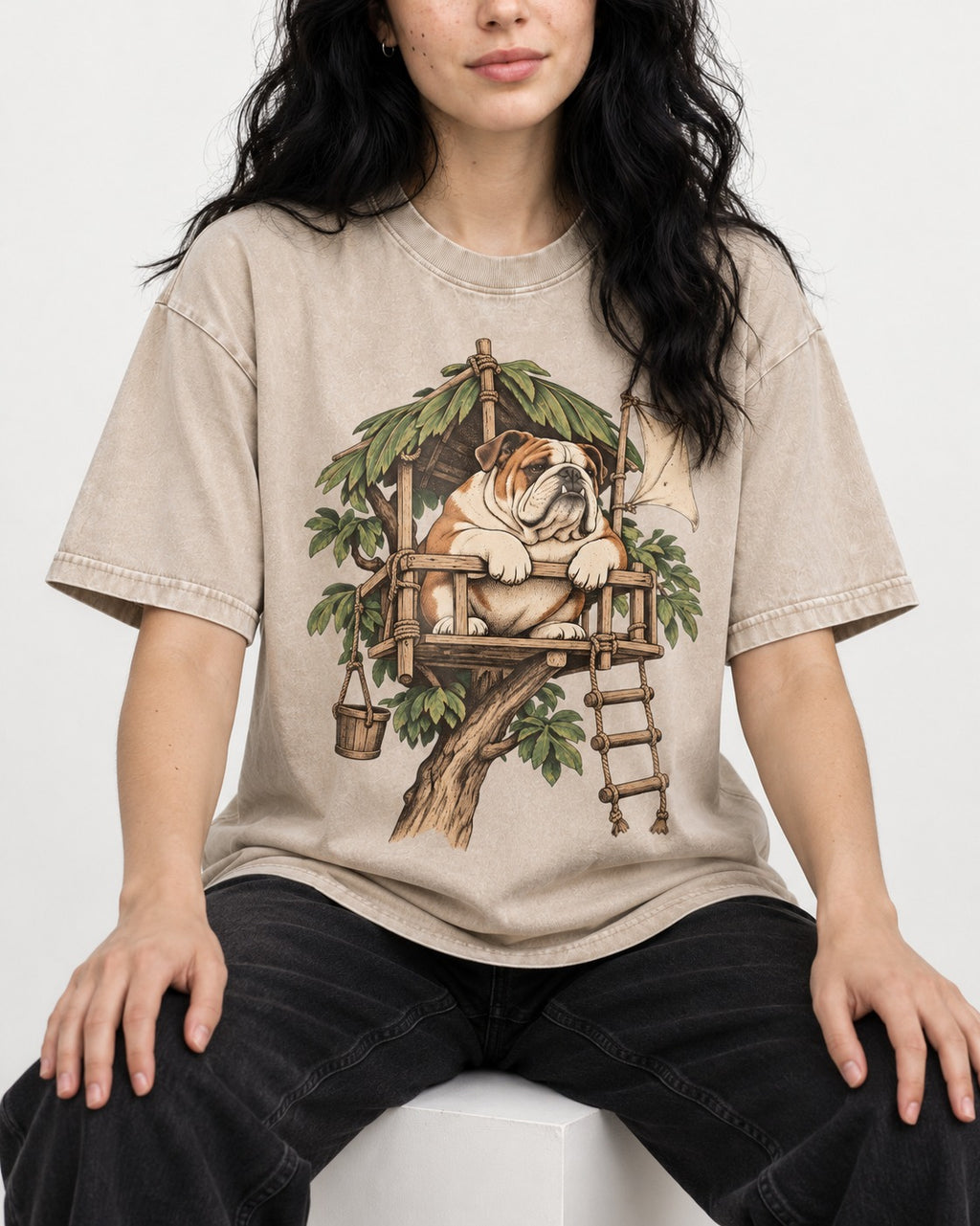 English Bulldog Above It All Washed Tee in Apricot, worn by a seated model