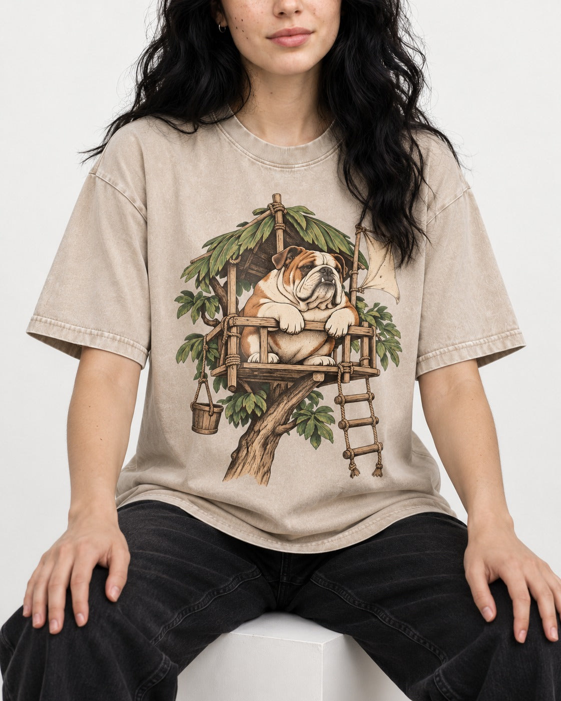 English Bulldog Above It All Washed Tee in Apricot, worn by a seated model