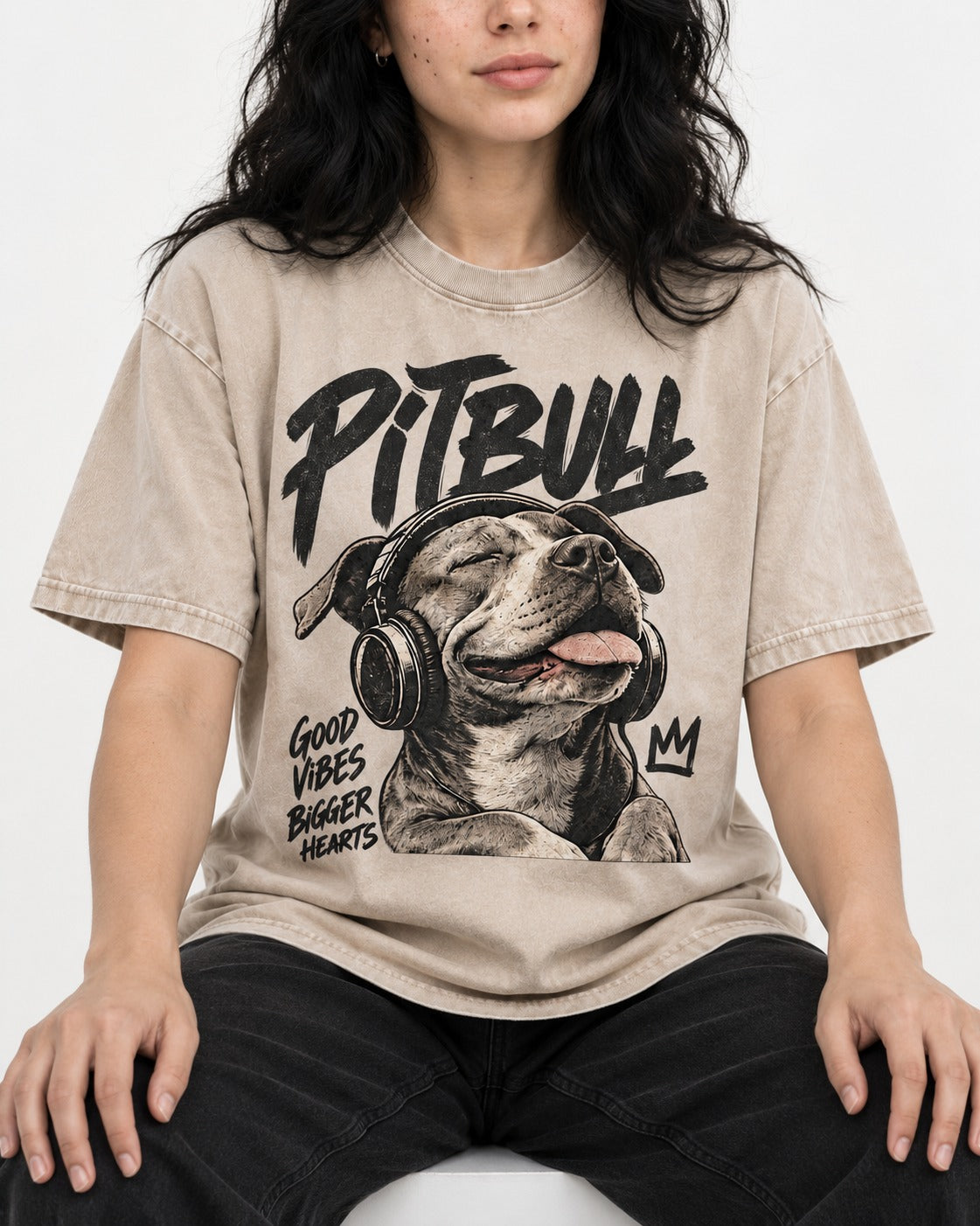 Pitbull Good Vibes Bigger Hearts Washed Tee in Apricot, worn by a seated model
