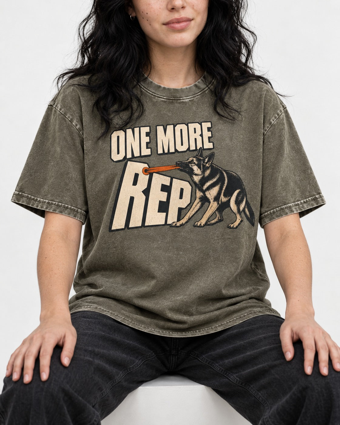 One More Rep Tug German Shepherd Dog Graphic Washed Tee in Army Green, worn by a seated model