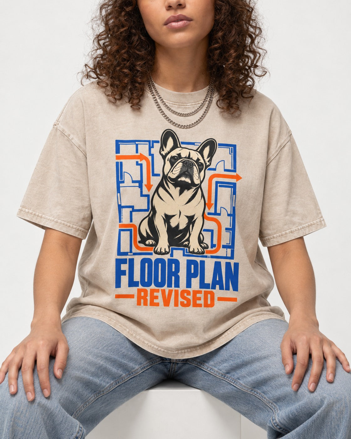 Frenchie Floor Plan Revised Washed Tee in Apricot, worn by a seated model