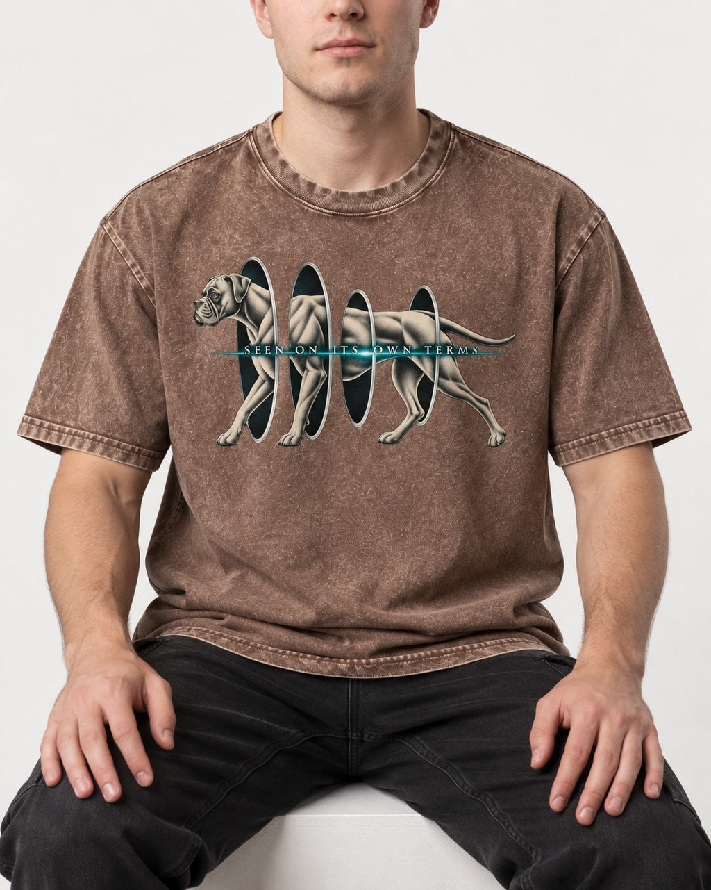 Boxer On Its Own Terms Washed Tee in Coffee, worn by a seated model