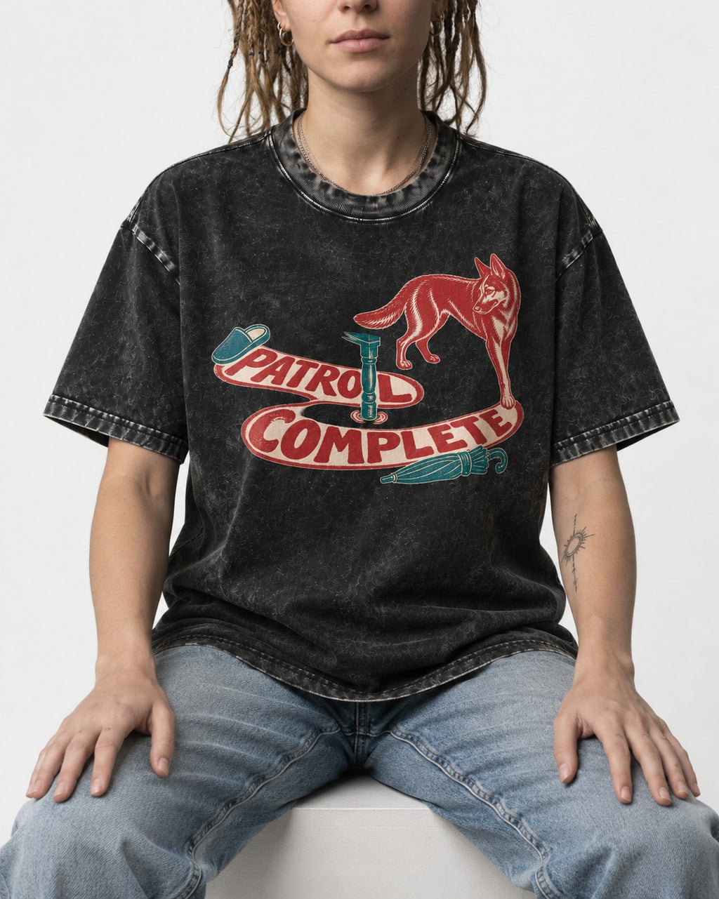 German Shepherd Dog Patrol Complete Umbrella Graphic Washed Tee in Black, worn by a seated model
