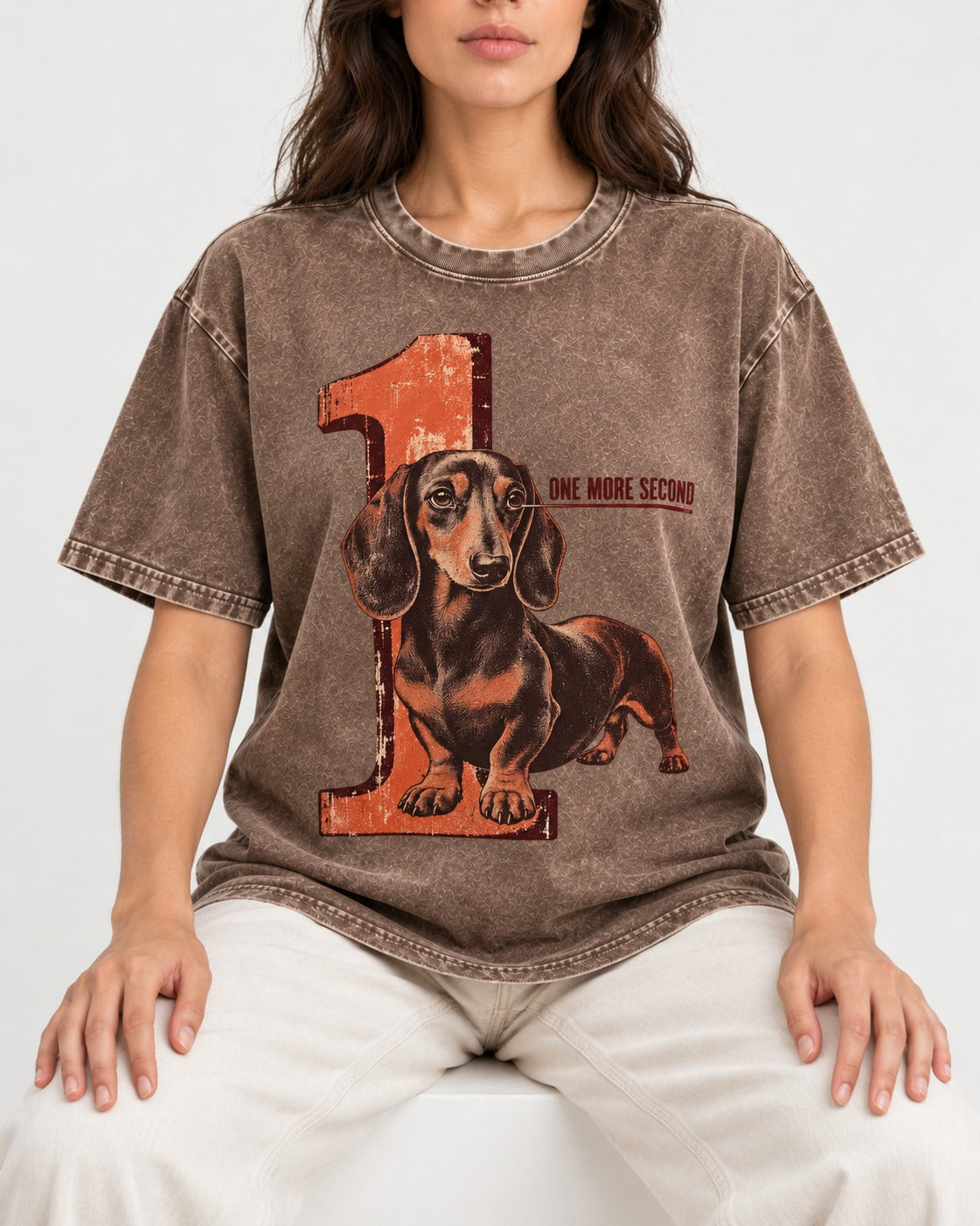 One More Second Dachshund Washed Tee in Coffee, worn by a seated model