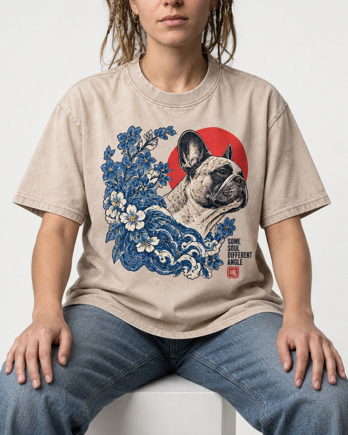 Some Soul Different Angle Frenchie Washed Tee in Apricot, worn by a seated model