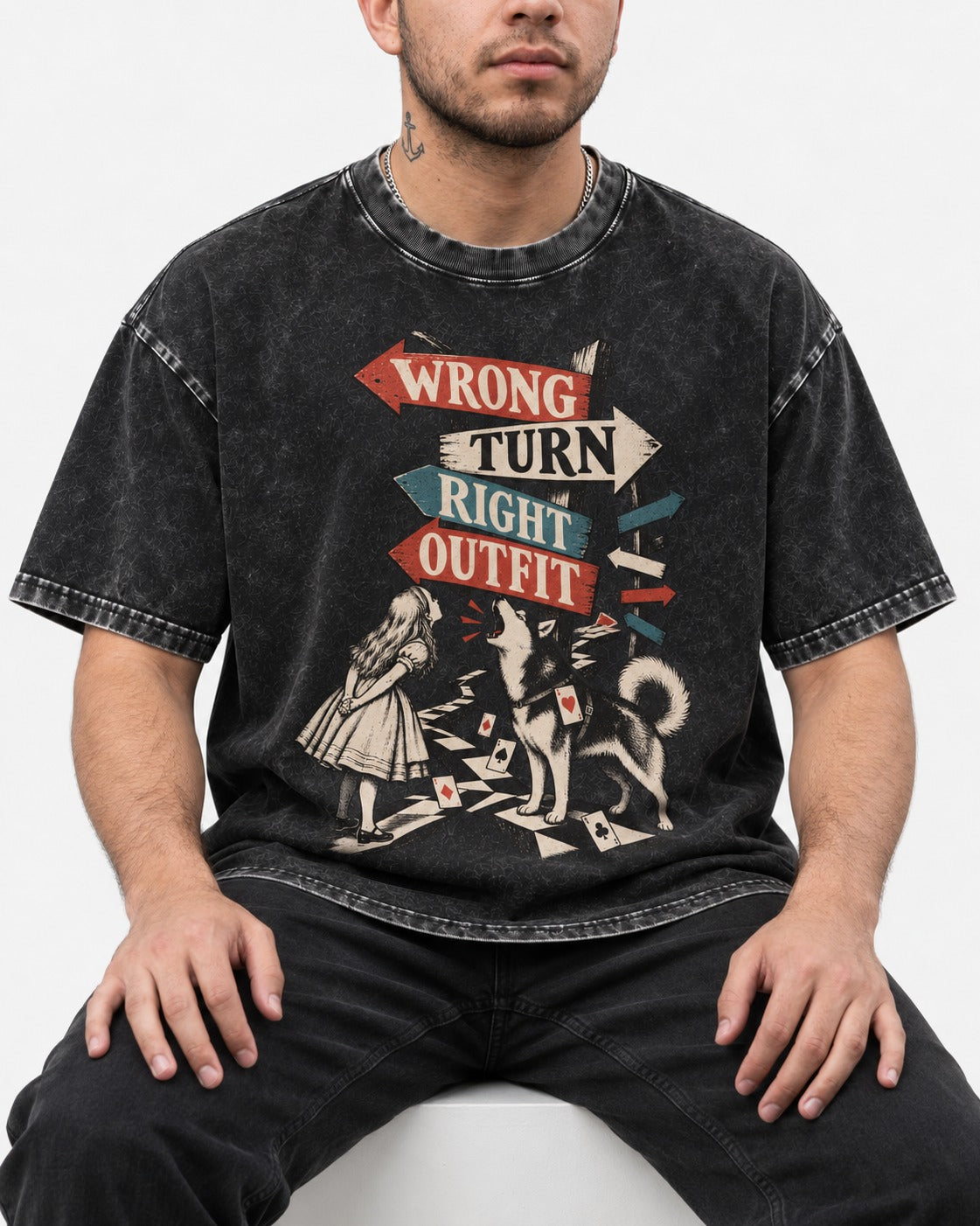 Husky Wrong Turn Right Outfit Wonderland Signpost Graphic Washed Tee in Black, worn by a seated model