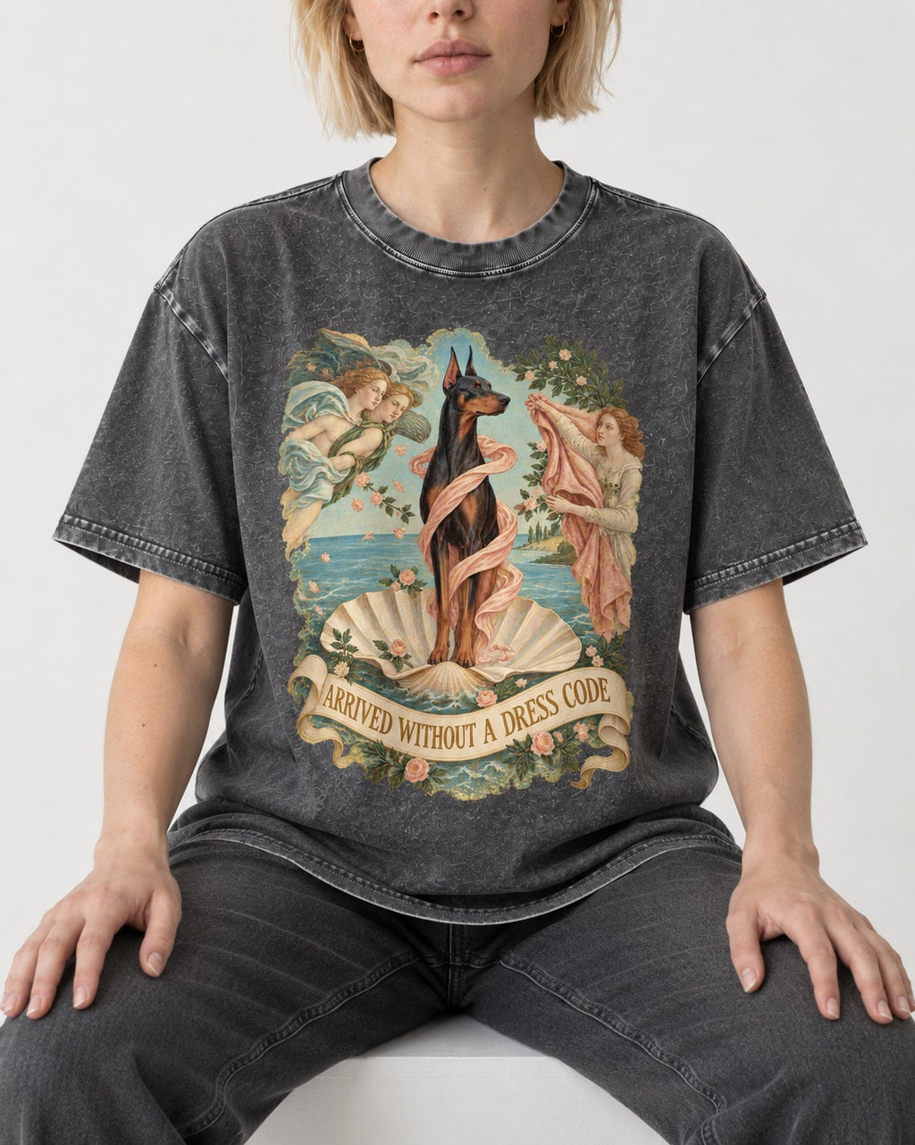 Doberman Arrived Without a Dress Code Renaissance Graphic Washed Tee in Gray, worn by a seated model