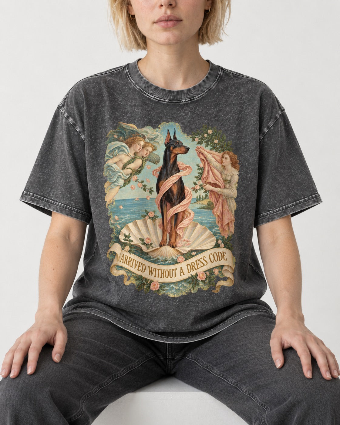 Doberman Arrived Without a Dress Code Renaissance Graphic Washed Tee in Gray, worn by a seated model