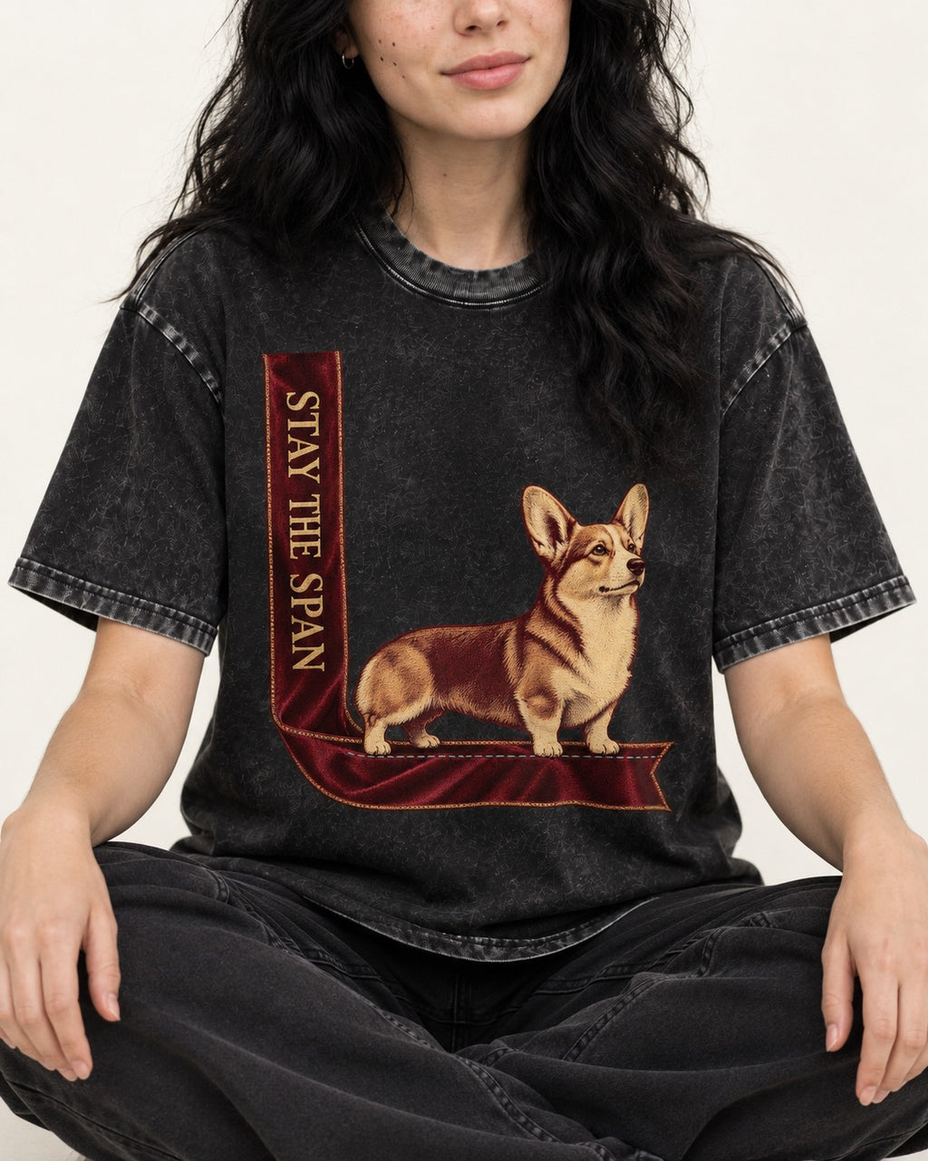 Corgi Stay the Span Ribbon Washed Tee in Black, worn by a seated model