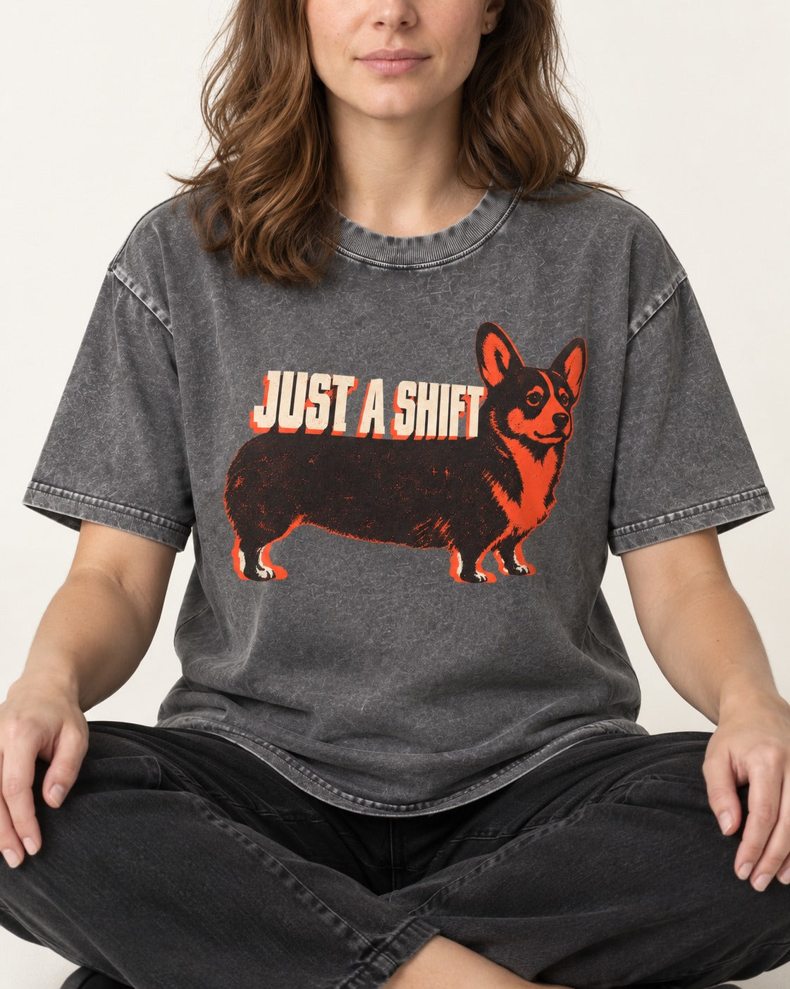Corgi Just a Shift Typographic Graphic Washed Tee in Gray, worn by a seated model
