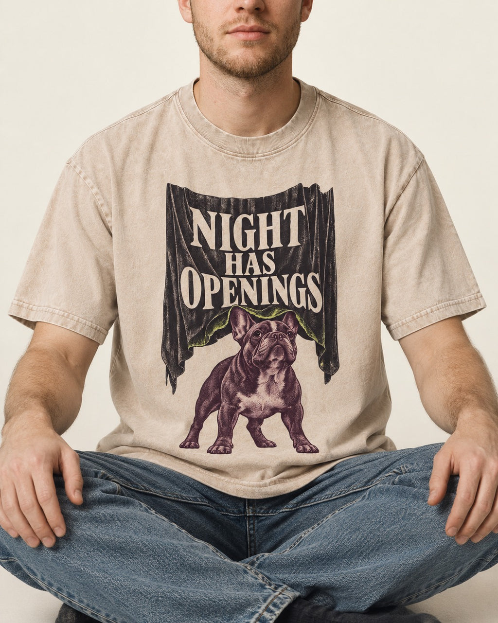 Night Has Openings Frenchie Washed Tee in Apricot, worn by a seated model
