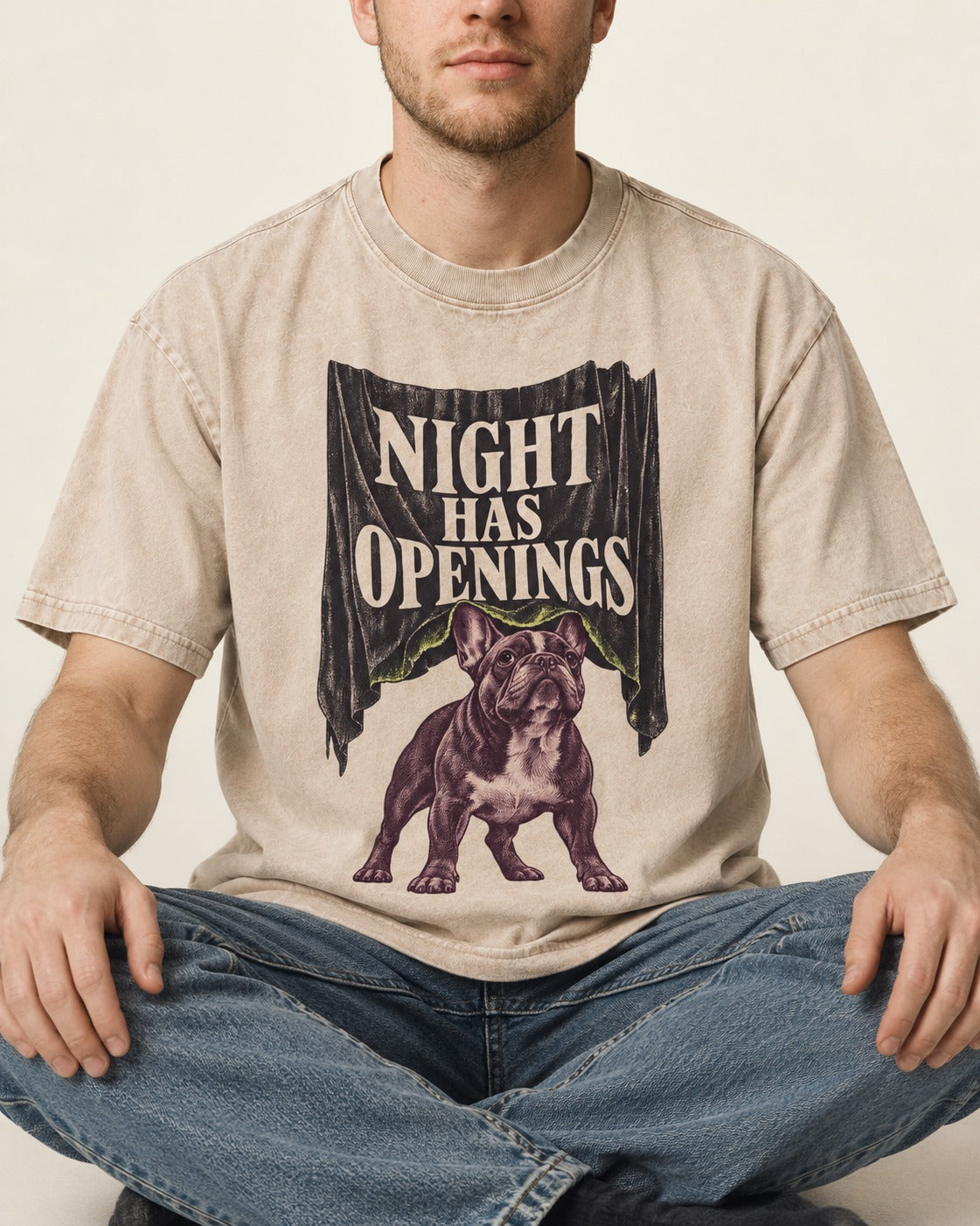 Night Has Openings Frenchie Washed Tee in Apricot, worn by a seated model