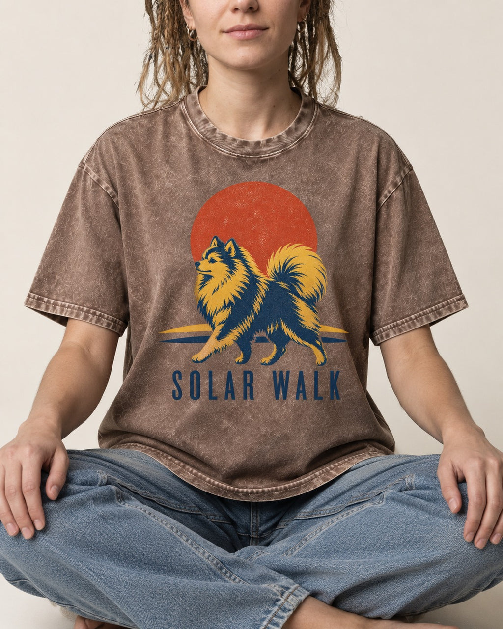 Pomeranian Solar Walk Washed Tee in Coffee, worn by a seated model