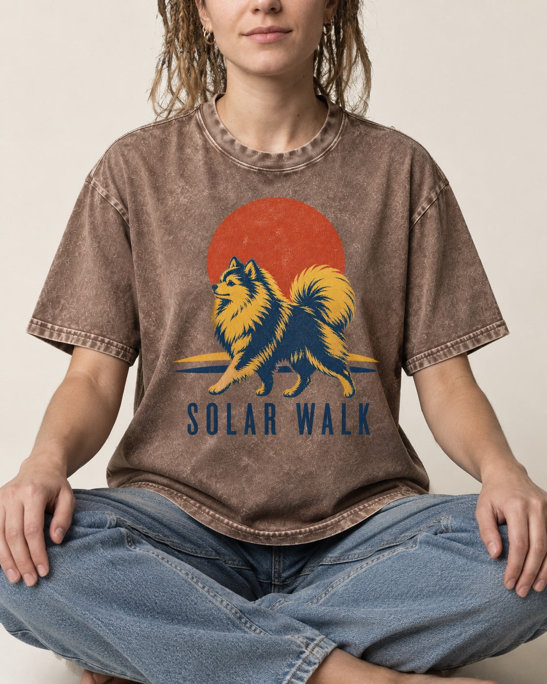 Pomeranian Solar Walk Washed Tee in Coffee, worn by a seated model