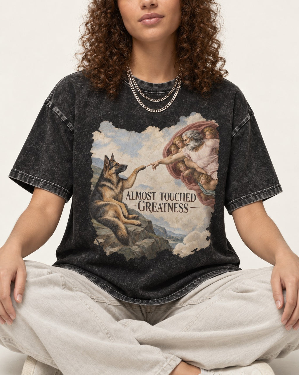 German Shepherd Dog Almost Touched Greatness Creation Parody Washed Tee in Black, worn by a seated model