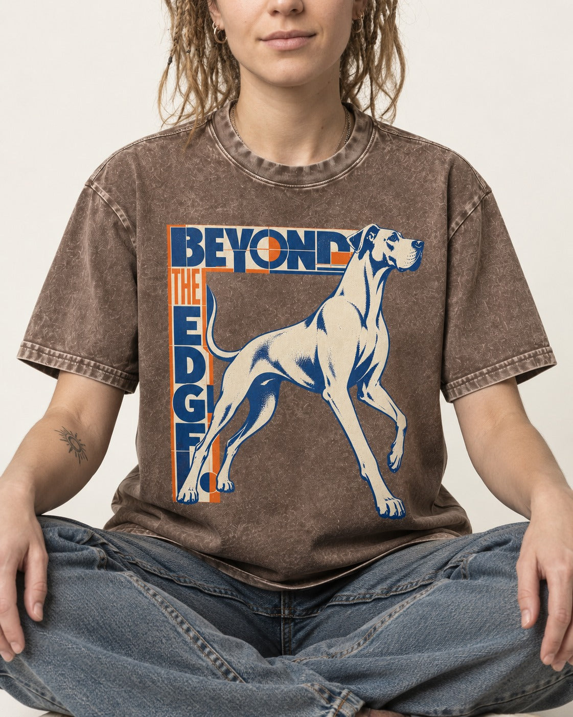 Great Dane Beyond the Edge Washed Tee in Coffee, worn by a seated model