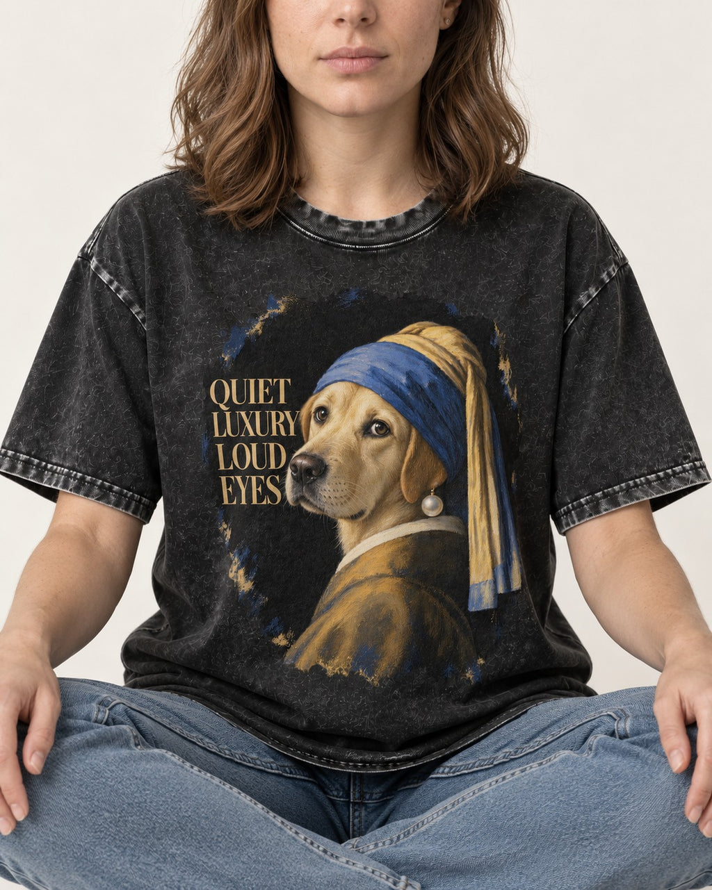 Labrador Retriever Quiet Luxury Loud Eyes Pearl Earring Graphic Washed Tee in Black, worn by a seated model