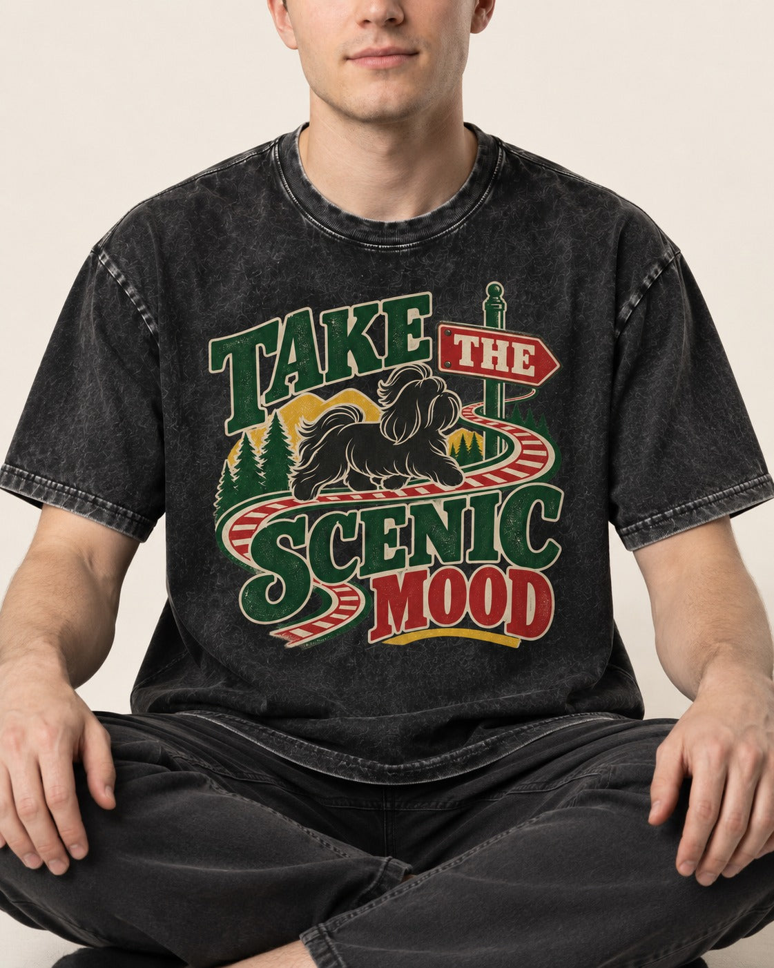 Shih Tzu Take the Scenic Mood Road Sign Graphic Washed Tee in Black, worn by a seated model