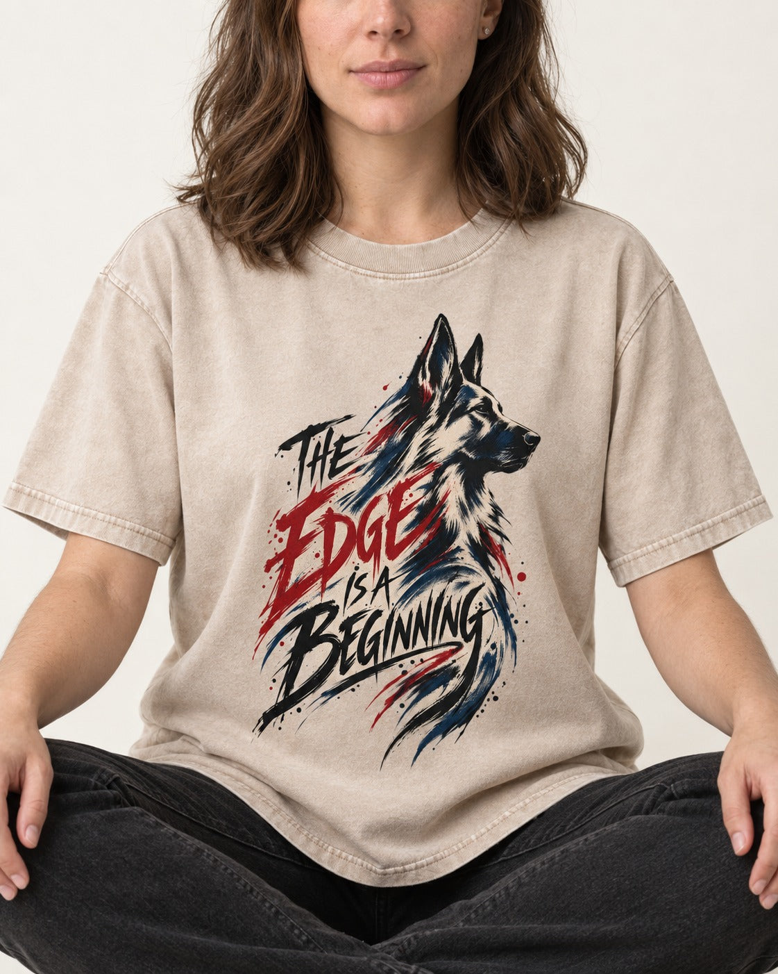 Edge Is a Beginning German Shepherd Dog Washed Tee in Apricot, worn by a seated model