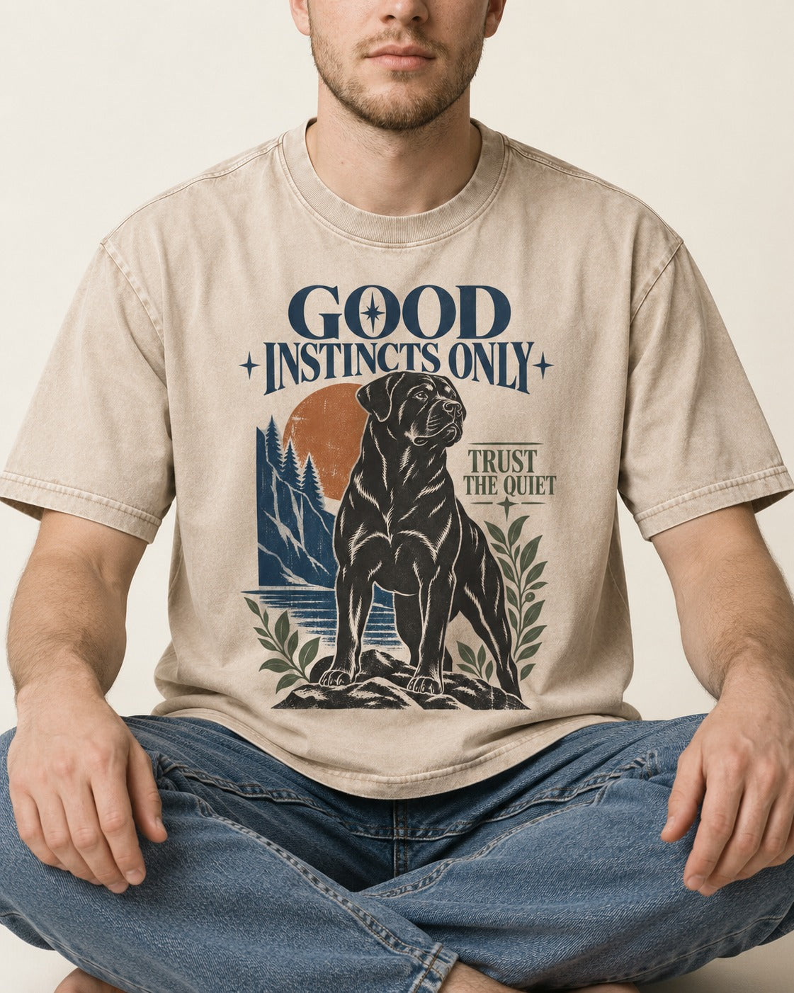 Good Instincts Only Rottweiler Washed Tee in Apricot, worn by a seated model