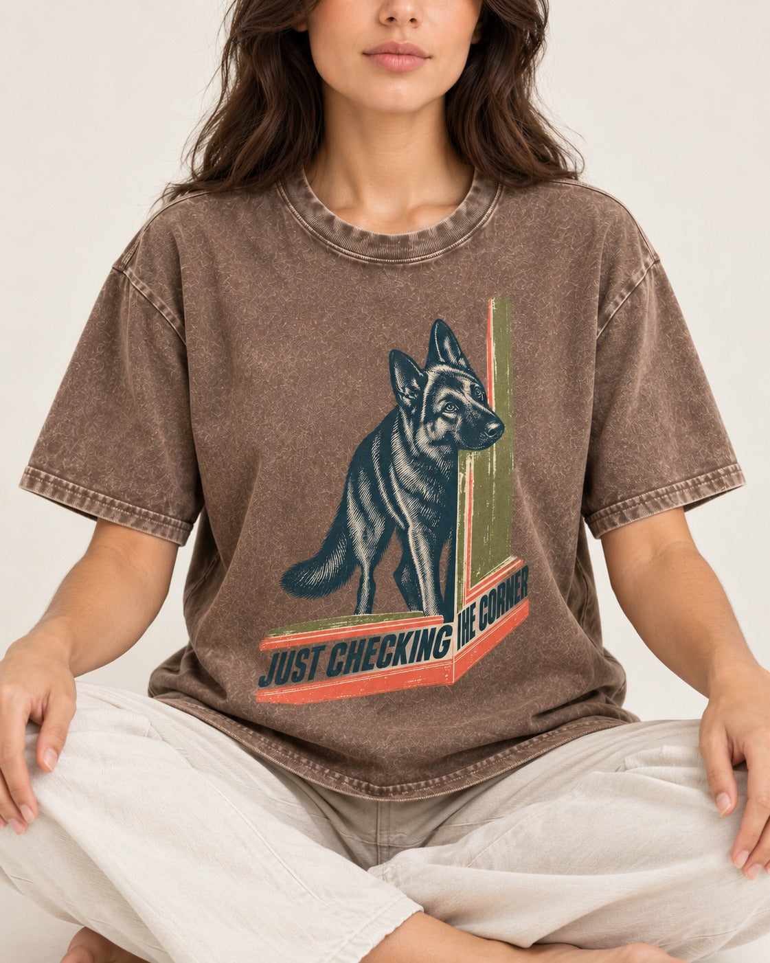 German Shepherd Dog Just Checking the Corner Washed Tee in Coffee, worn by a seated model