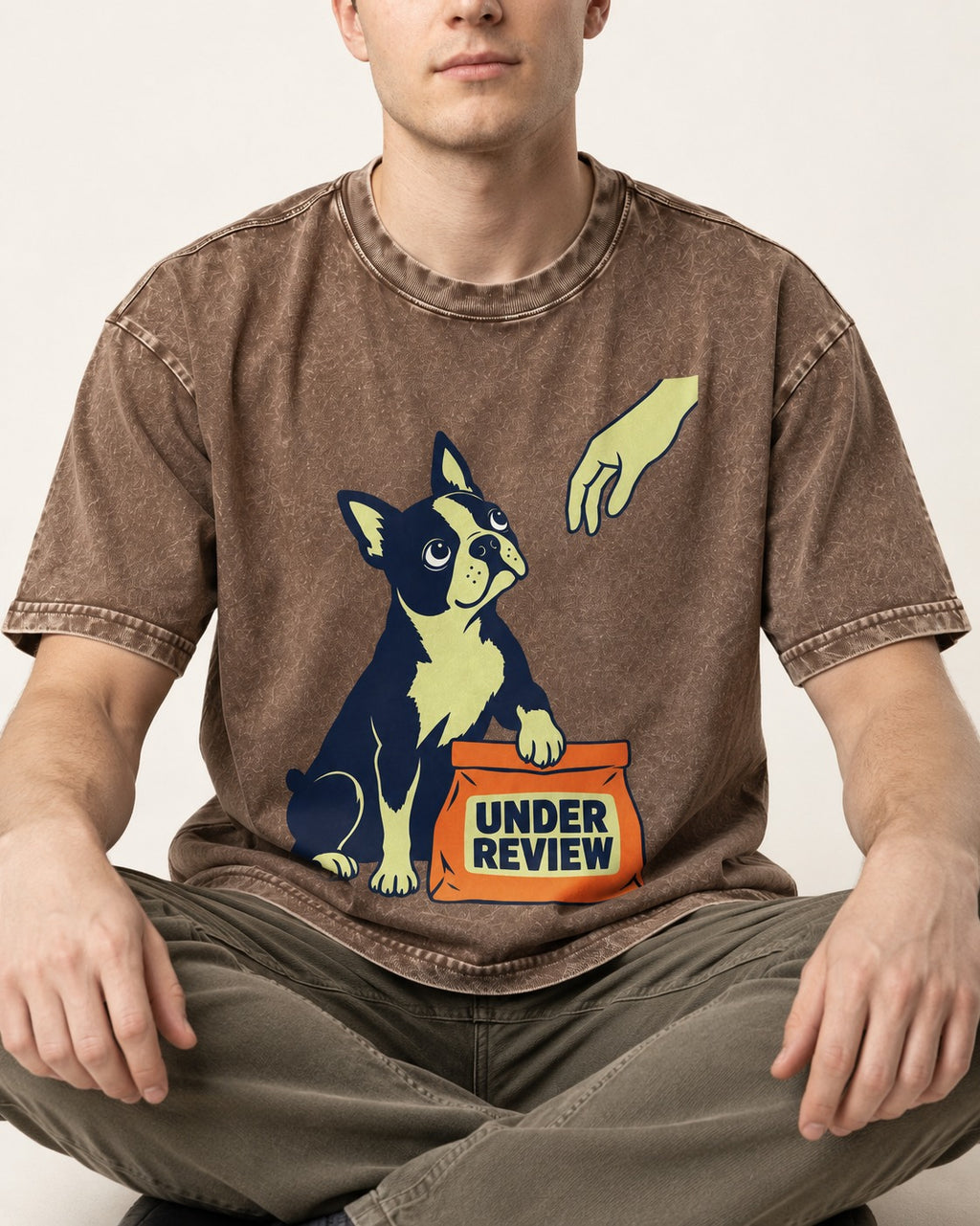 Boston Terrier Under Review Washed Tee in Coffee, worn by a seated model