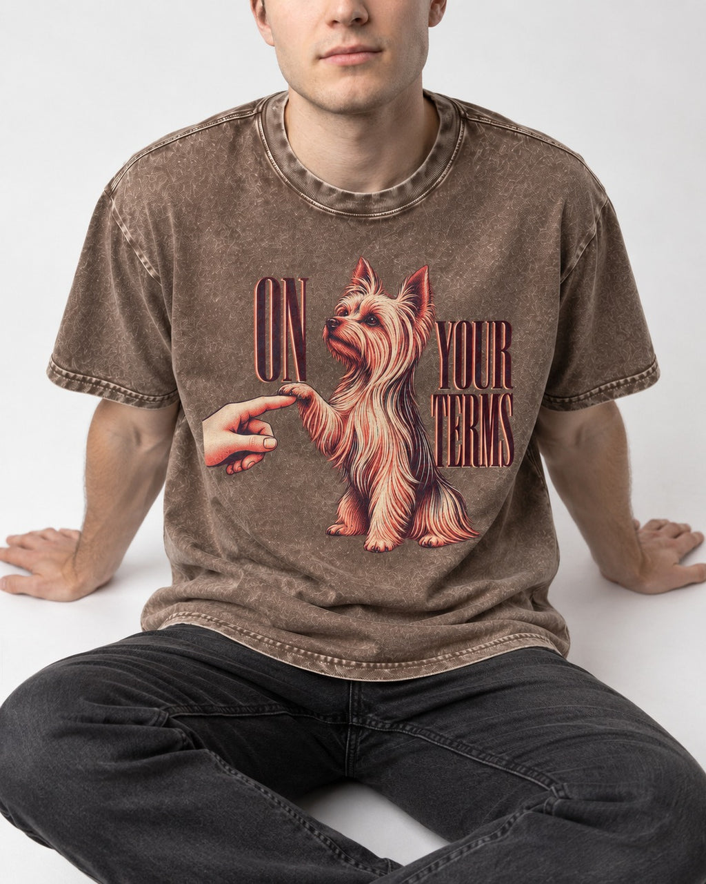 Yorkshire Terrier On Your Terms Washed Tee in Coffee, worn by a seated model