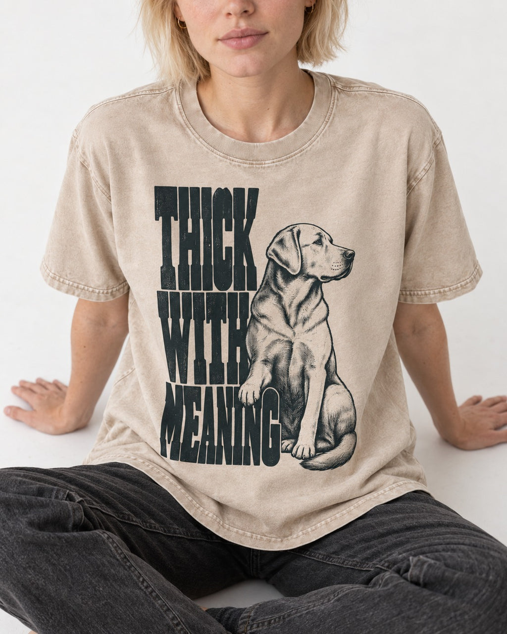 Thick with Meaning Labrador Retriever Washed Tee in Apricot, worn by a seated model