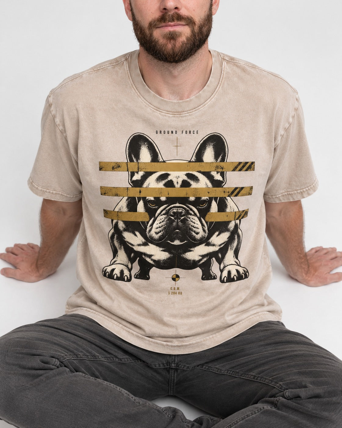 Frenchie Ground Force Industrial Barrier Graphic Washed Tee in Apricot, worn by a seated model