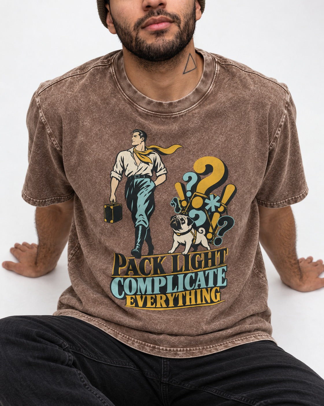 Pug Pack Light Complicate Everything Washed Tee in Coffee, worn by a seated model