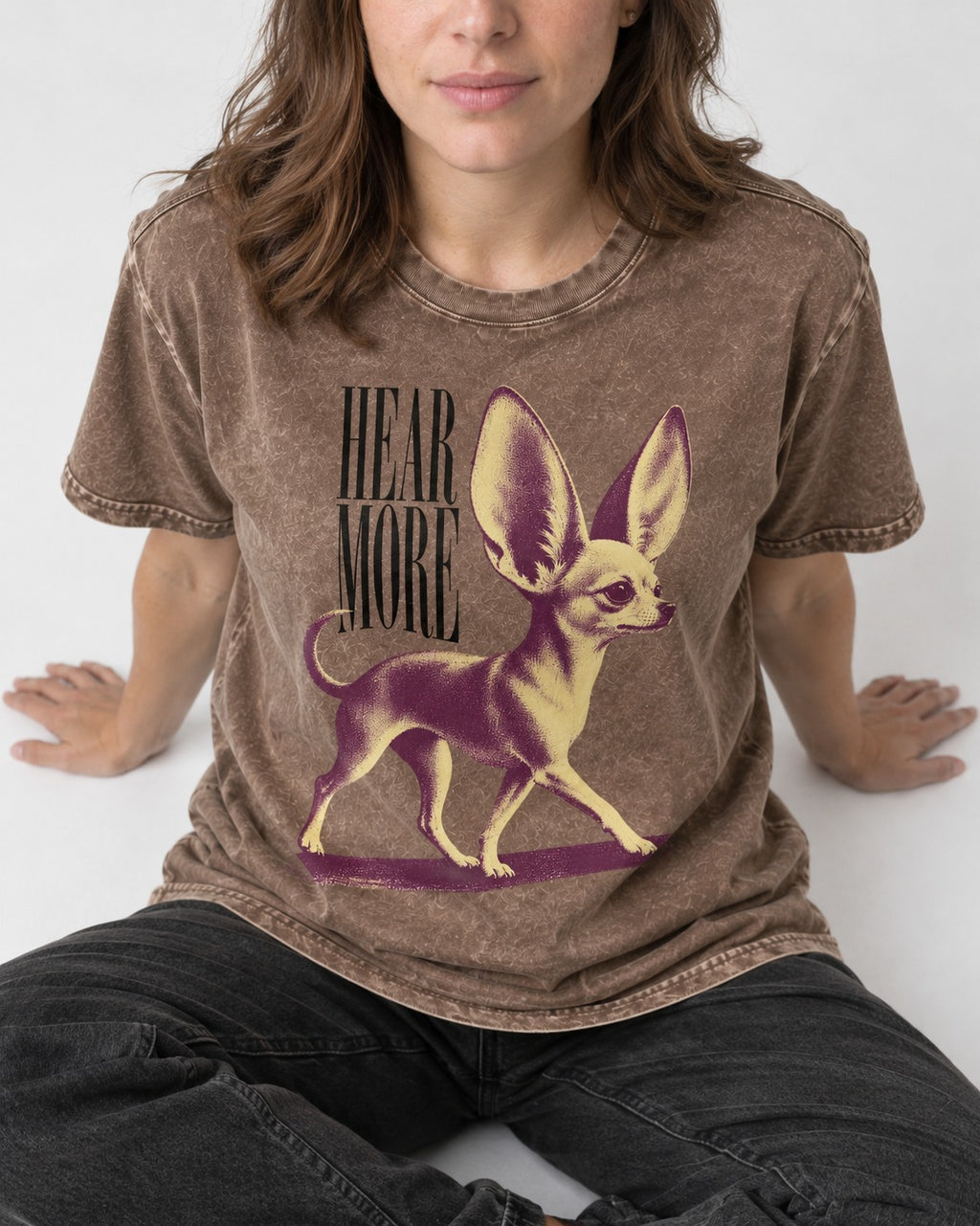 Hear More Chihuahua Washed Tee in Coffee, worn by a seated model