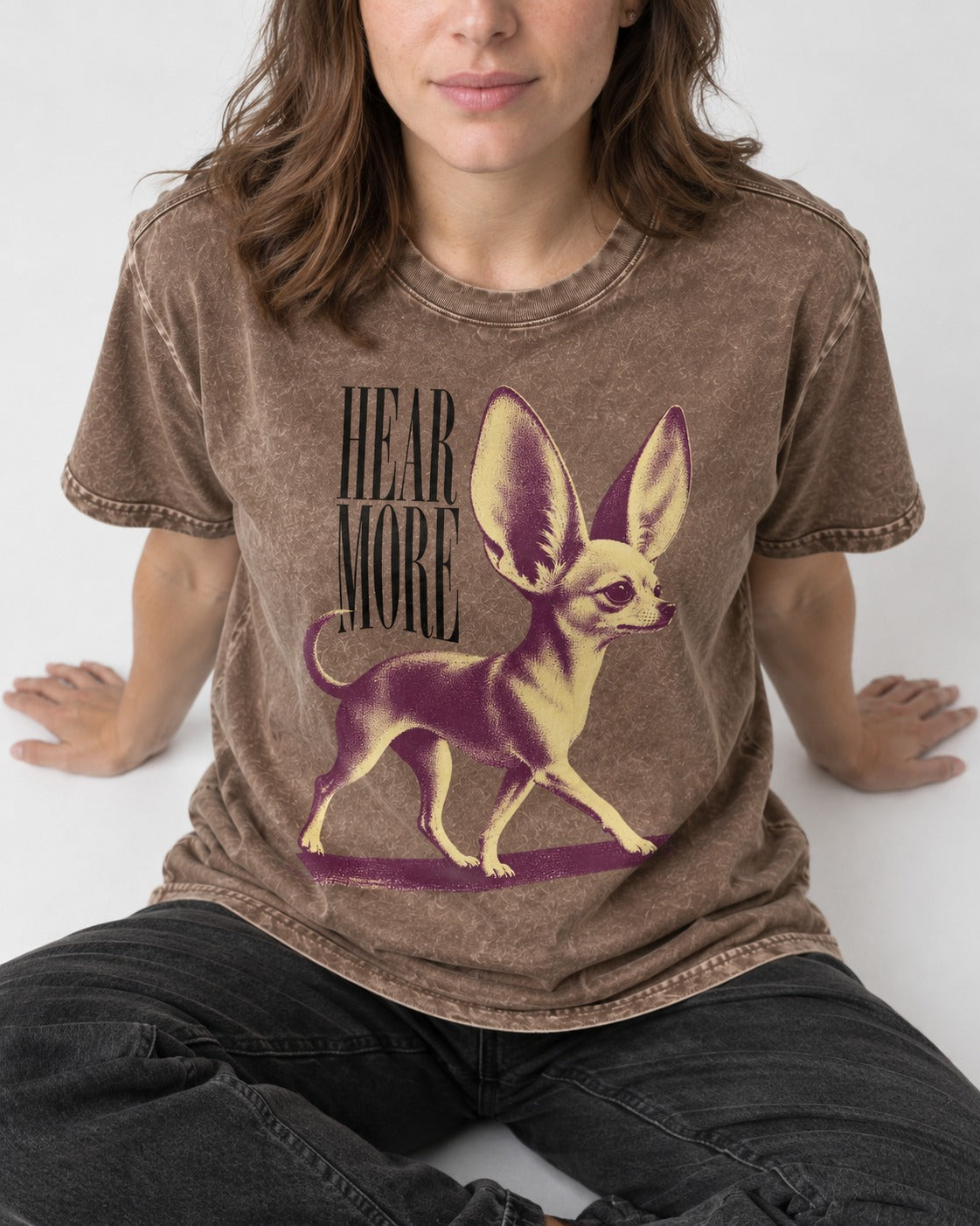 Hear More Chihuahua Washed Tee in Coffee, worn by a seated model