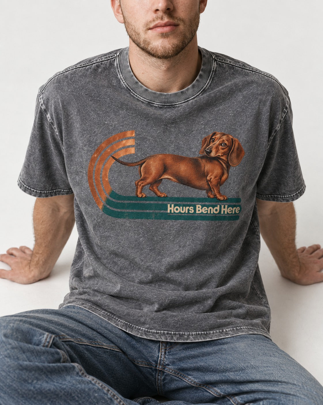 Dachshund Hours Bend Here Retro Track Graphic Washed Tee in Gray, worn by a seated model