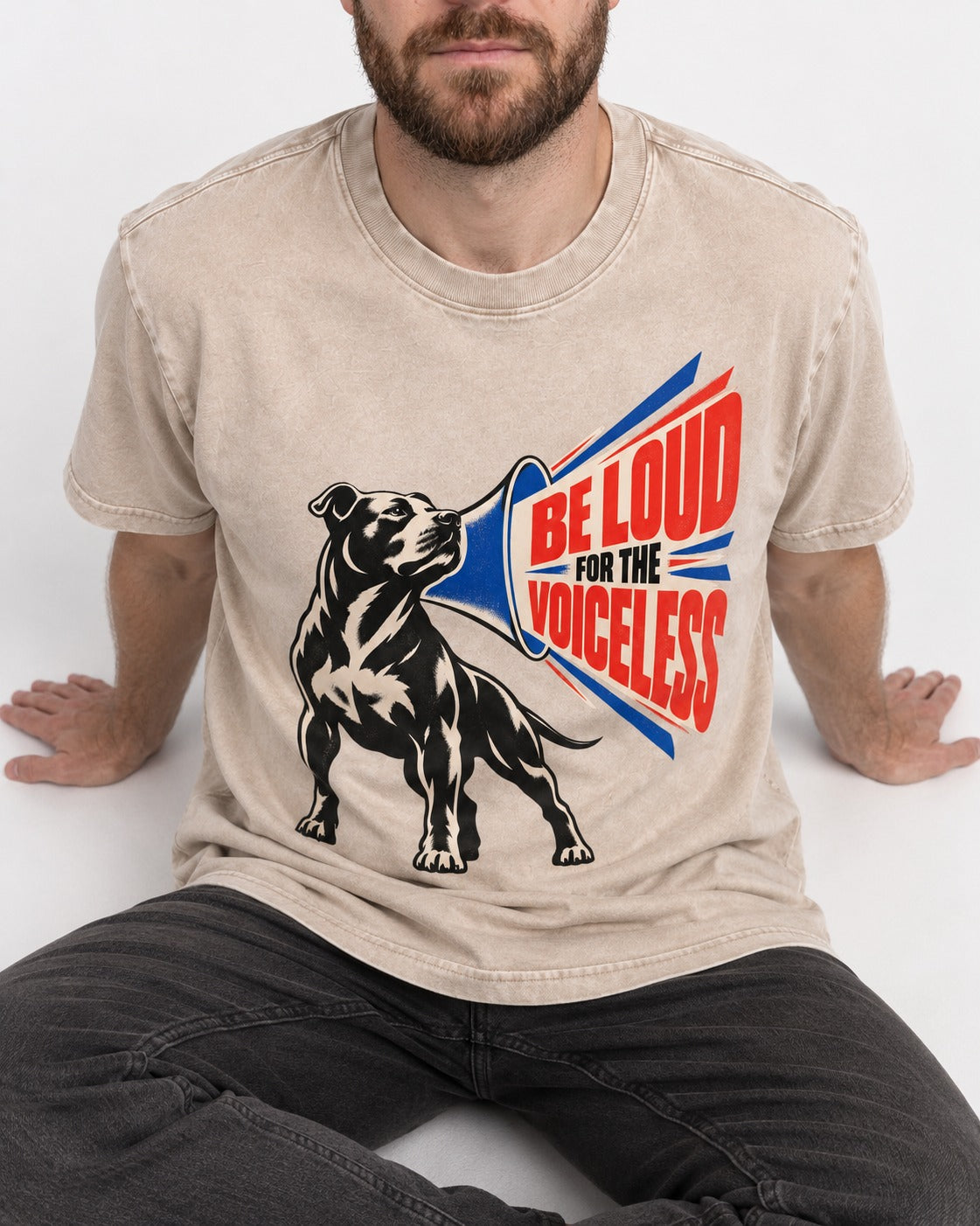 Pitbull For the Voiceless Washed Tee in Apricot, worn by a seated model