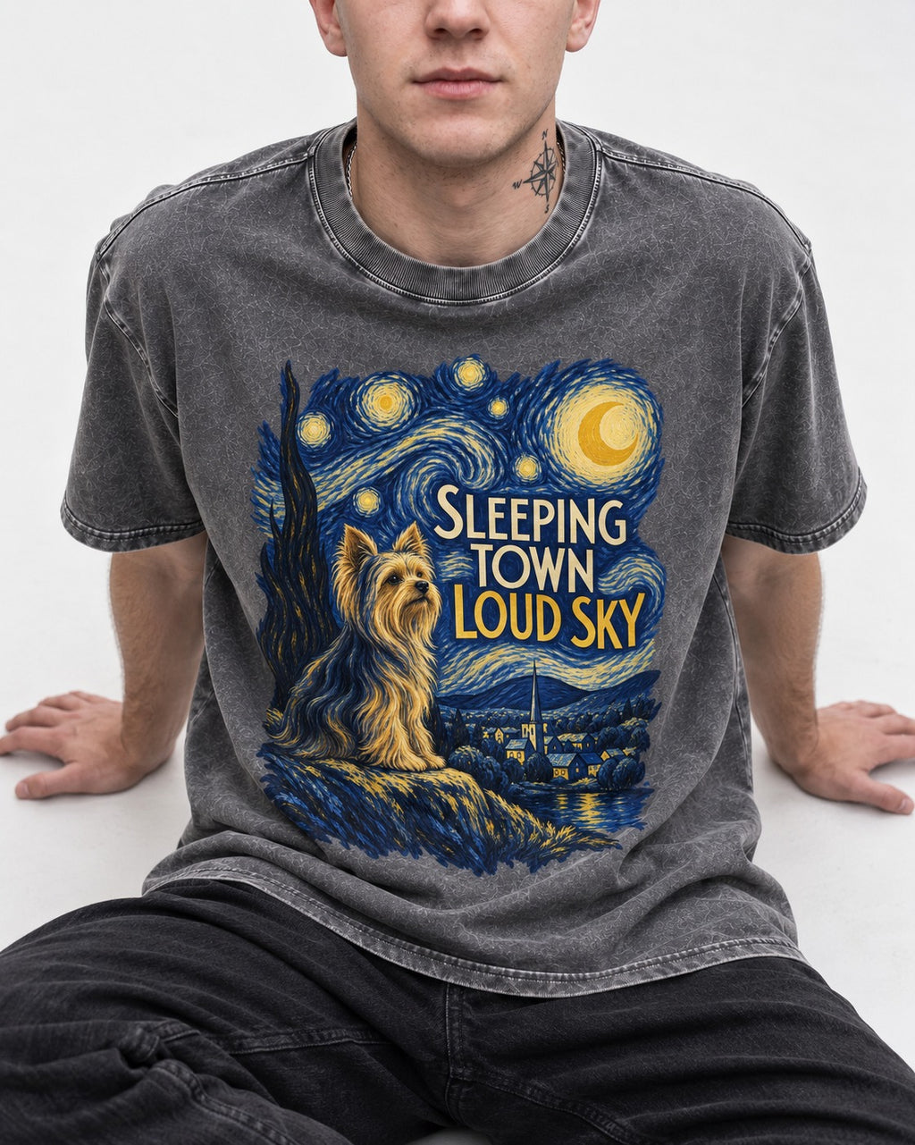 Yorkshire Terrier Sleeping Town Loud Sky Starry Night Graphic Washed Tee in Gray, worn by a seated model