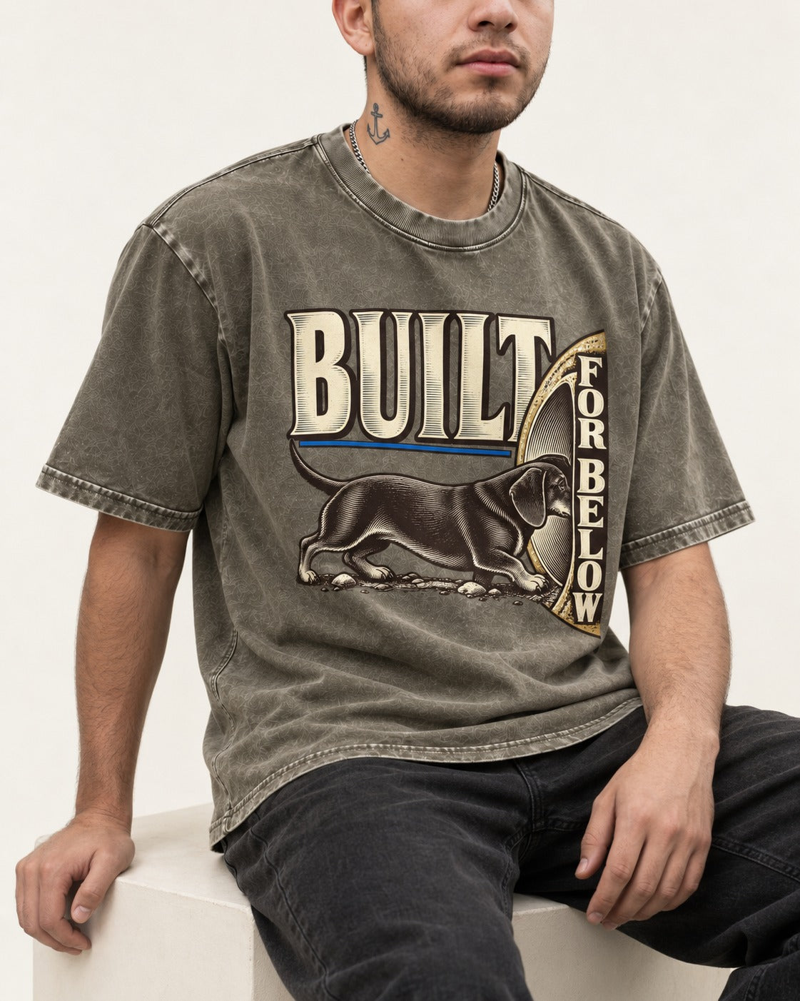 Dachshund Built for Below Vintage Burrow Graphic Washed Tee in Army Green, worn by a seated model