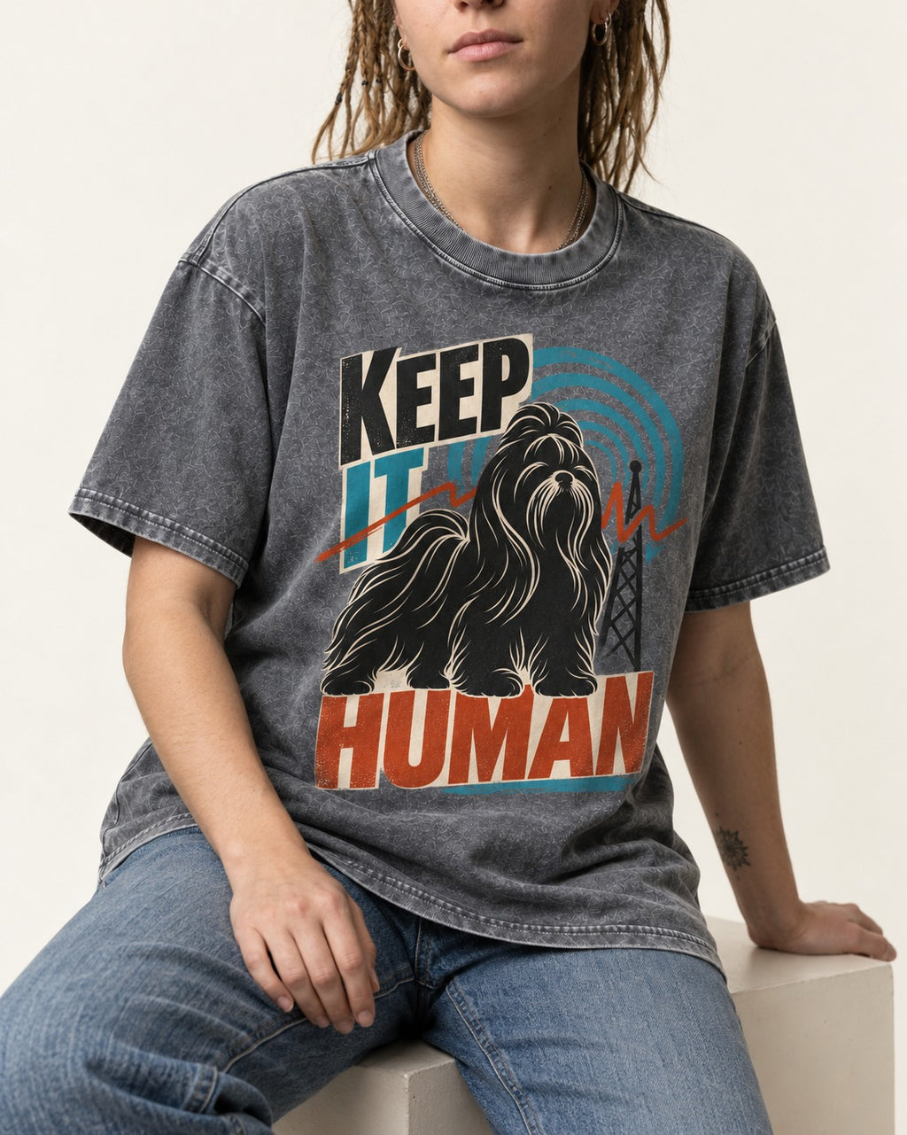 Shih Tzu Keep It Human Radio Signal Graphic Washed Tee in Gray, worn by a seated model