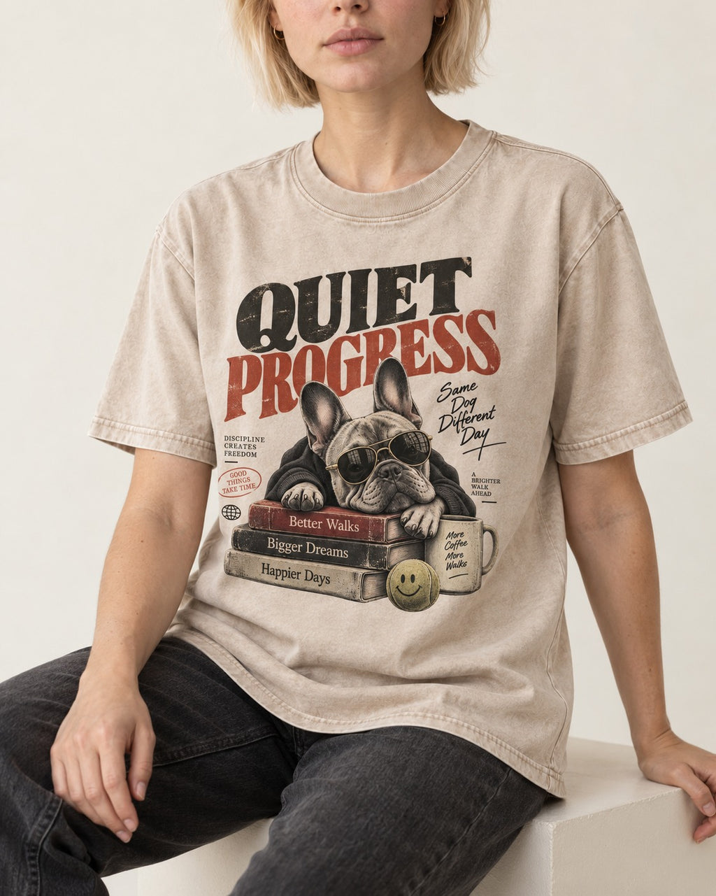 Quiet Progress Frenchie Washed Tee in Apricot, worn by a seated model
