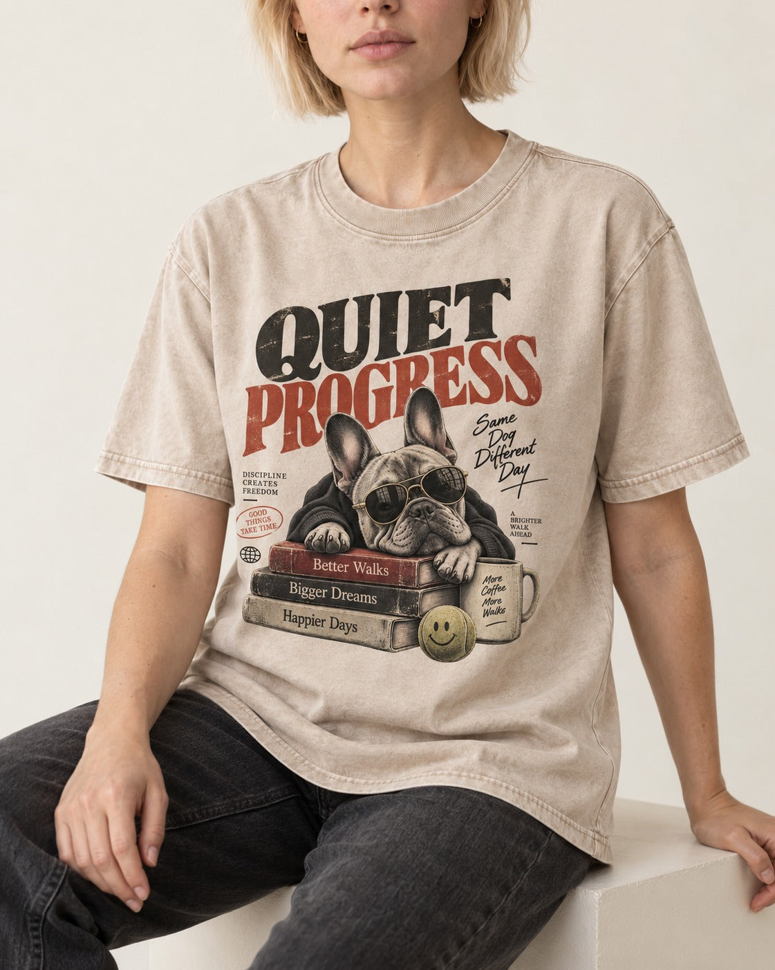 Quiet Progress Frenchie Washed Tee in Apricot, worn by a seated model