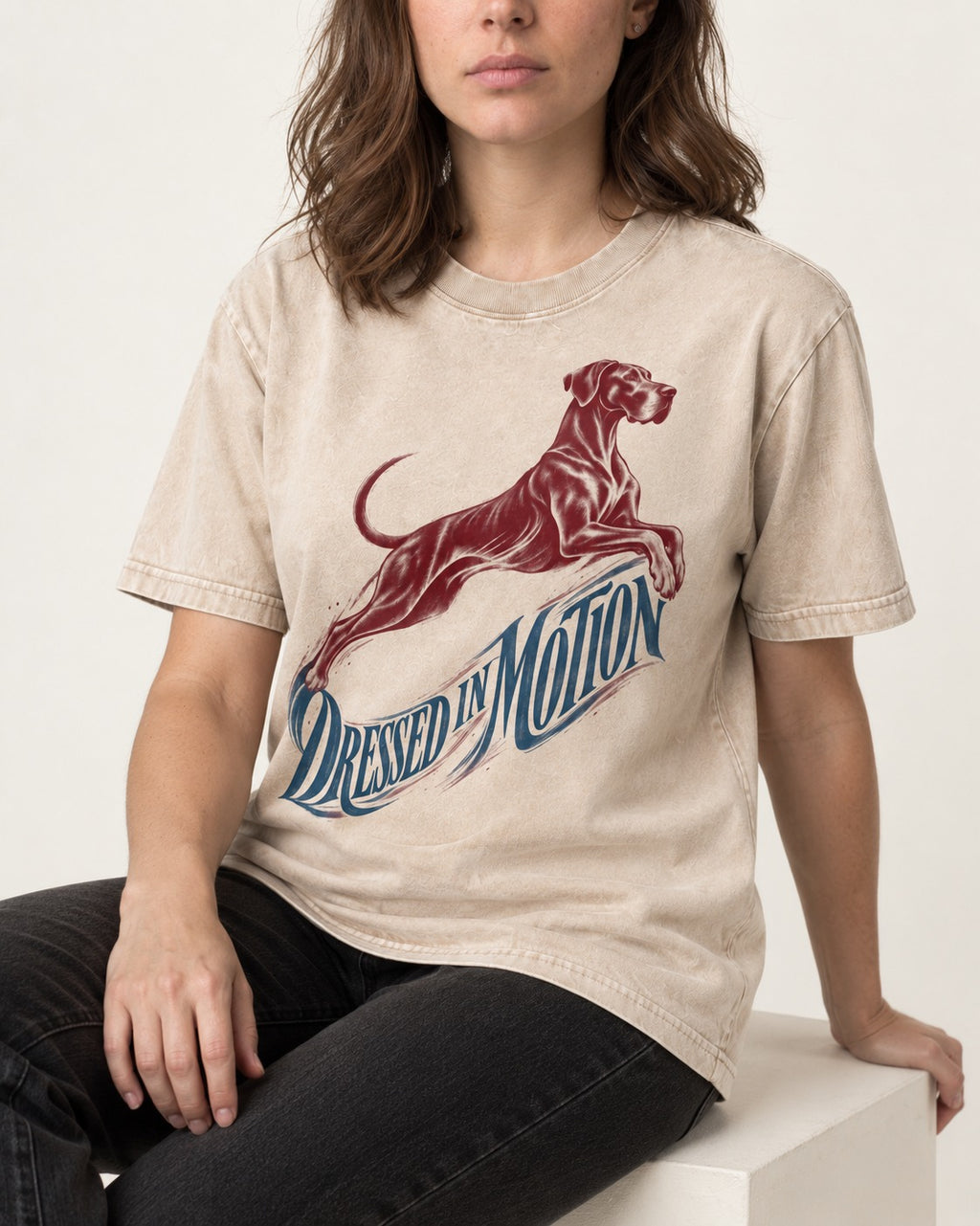 Great Dane Dressed in Motion Washed Tee in Apricot, worn by a seated model