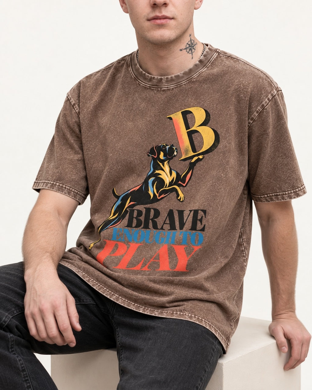 Boxer Brave Enough to Play Washed Tee in Coffee, worn by a seated model