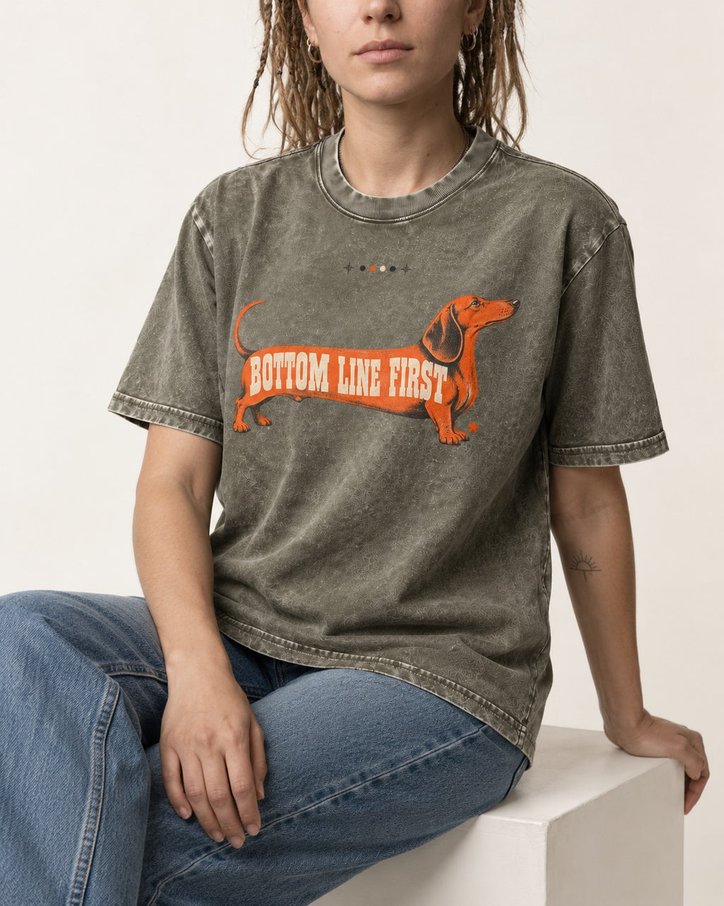Dachshund Bottom Line First Body Lettering Graphic Washed Tee in Army Green, worn by a seated model